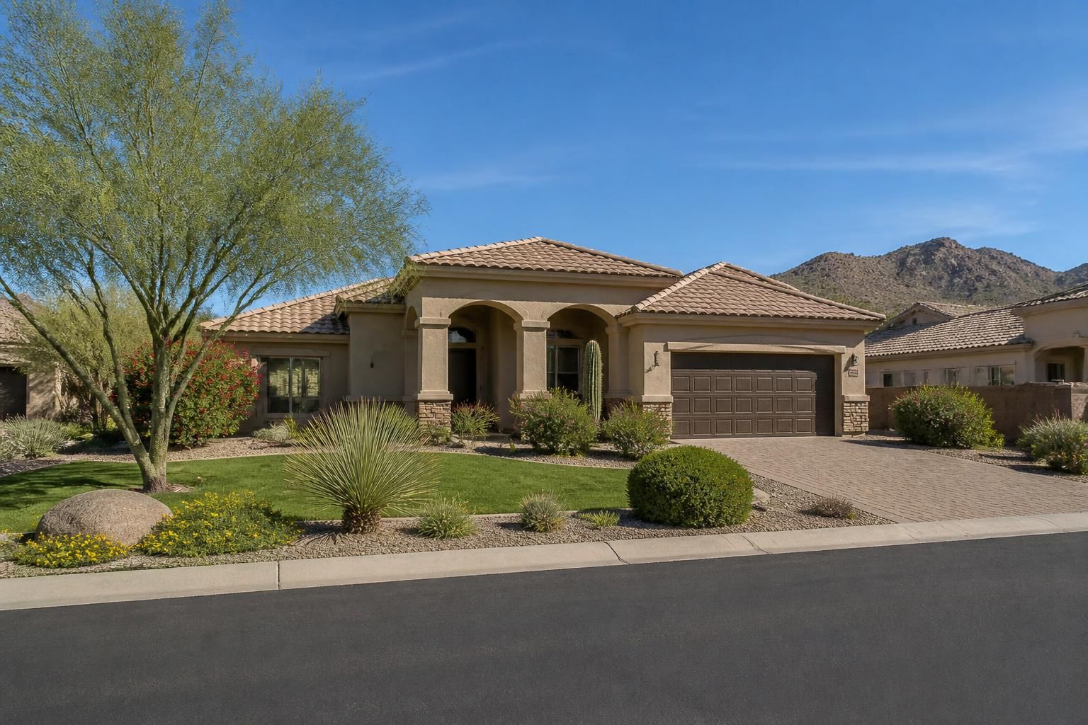Deer Valley neighborhood with neat front yards and greenery.